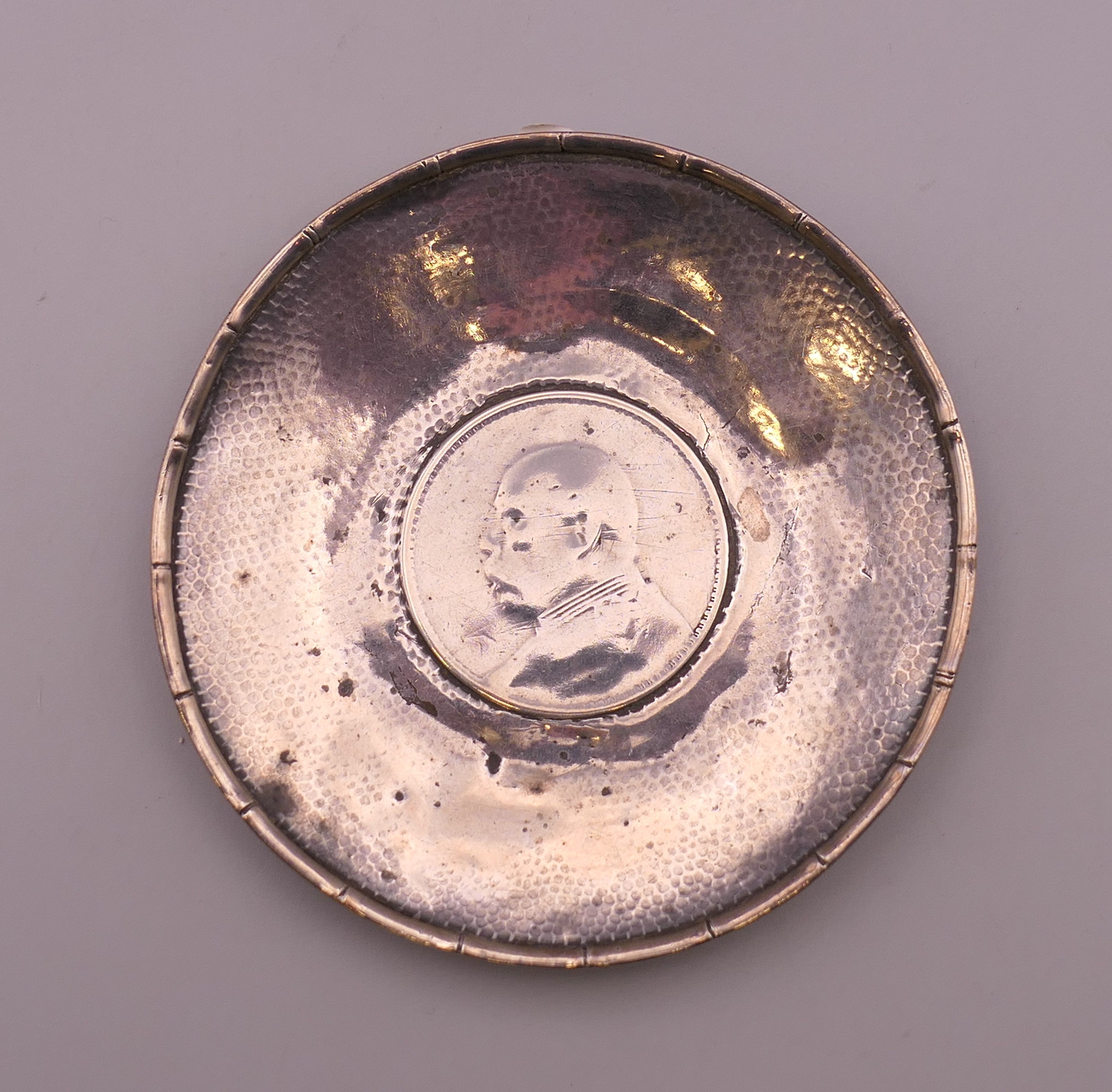 Two Chinese silver dishes inset with coins. 9.5 cm diameter. 117.9 grammes total weight. - Image 4 of 5