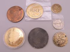 A small collection of coins/medallions.