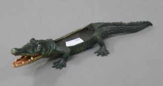 A cold painted bronze model of a crocodile. 21.5 cm long.