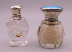 A blue enamelled silver top cut glass scent bottle and a silver top cut glass scent bottle.