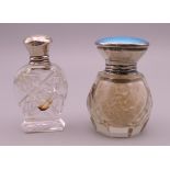 A blue enamelled silver top cut glass scent bottle and a silver top cut glass scent bottle.