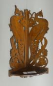 A late 19th/early 20th century fret carved corner shelf. 37 cm high.