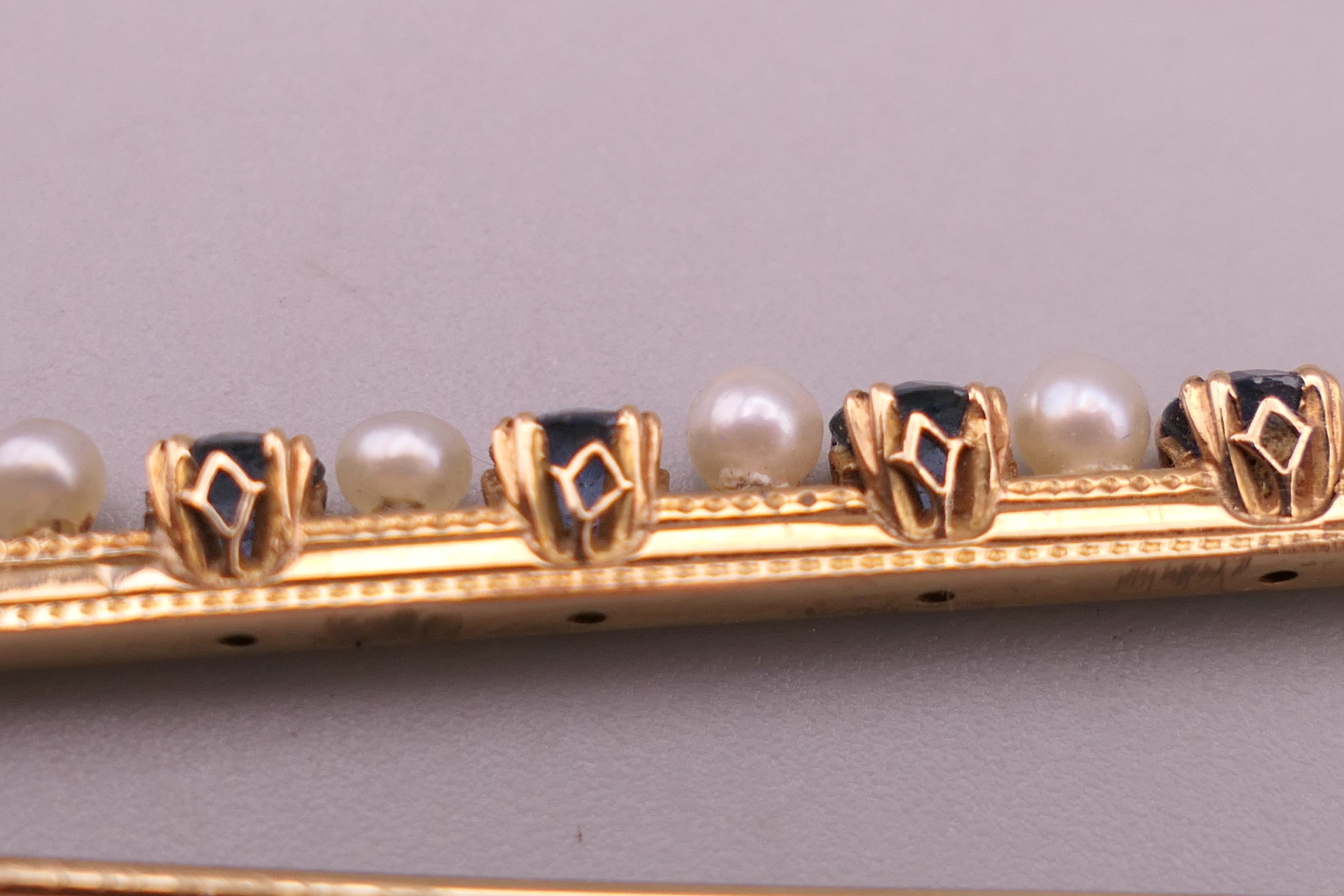 An antique natural sapphire and seed pearl unmarked gold (high carat tested) brooch, boxed. - Image 8 of 10