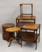 An oak tea trolley, three side tables and a commode.