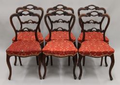 A set of six rosewood dining chairs.