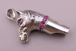 A whistle formed as a horse's head. 4 cm high.