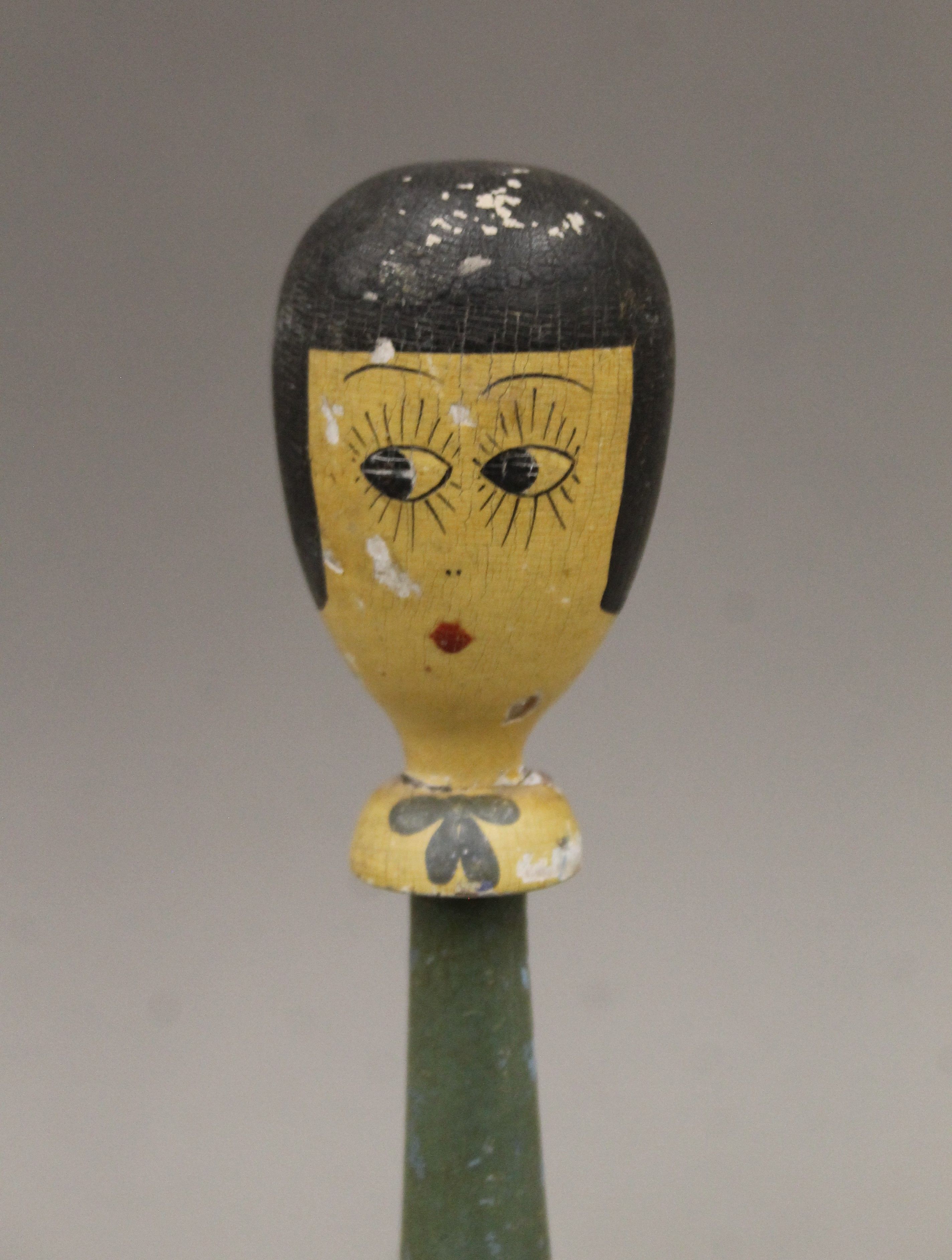 An early 20th century painted wooden display stand of female figural form. 25 cm high. - Image 2 of 3