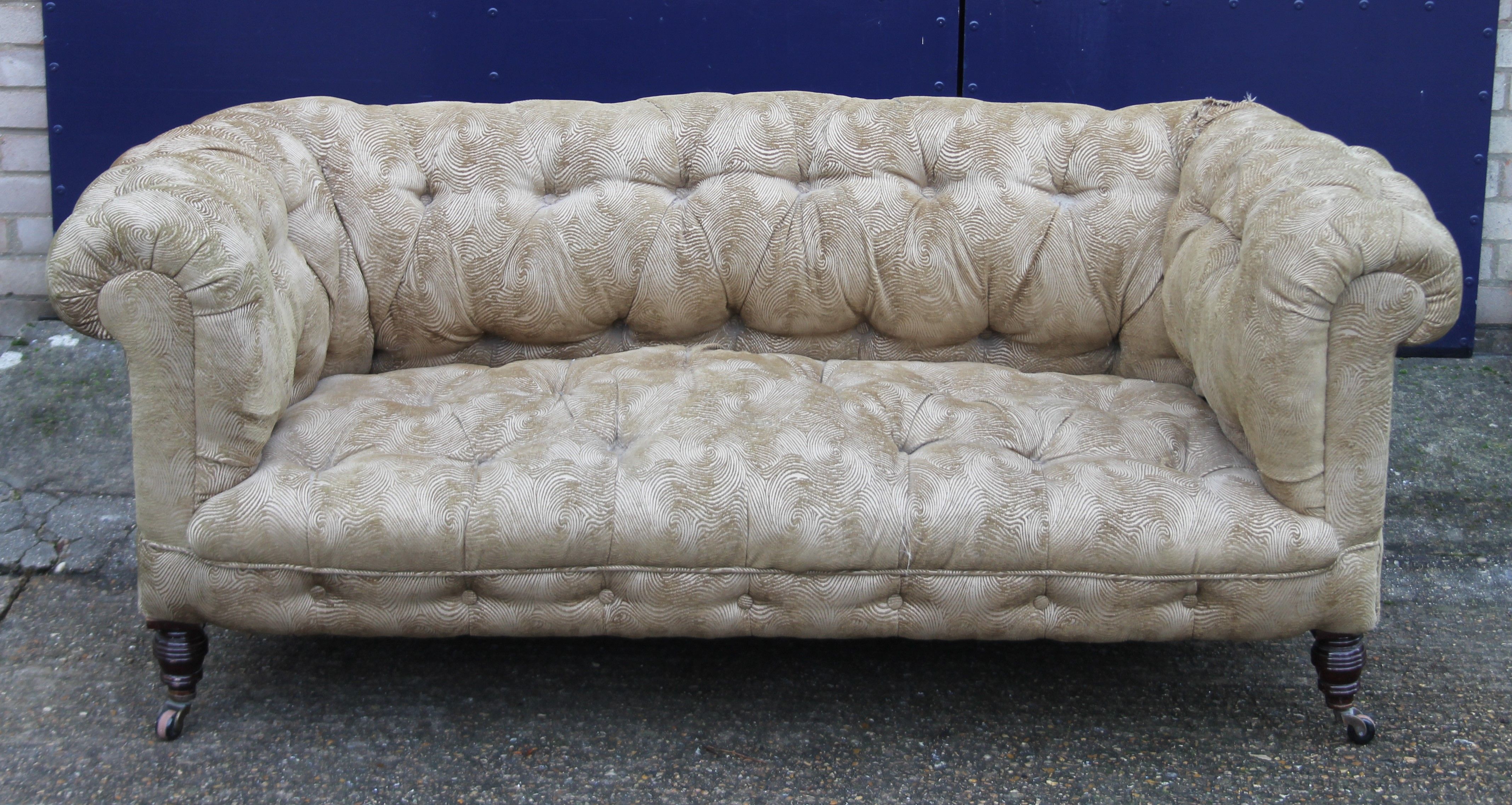 A Victorian Chesterfield settee. Approximately 170 cm long.