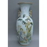 A large 19th century Chinese vase decorated with immortals and young attendants. 58 cm high.