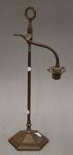 An Arts & Crafts bronze desk lamp. 56 cm high.