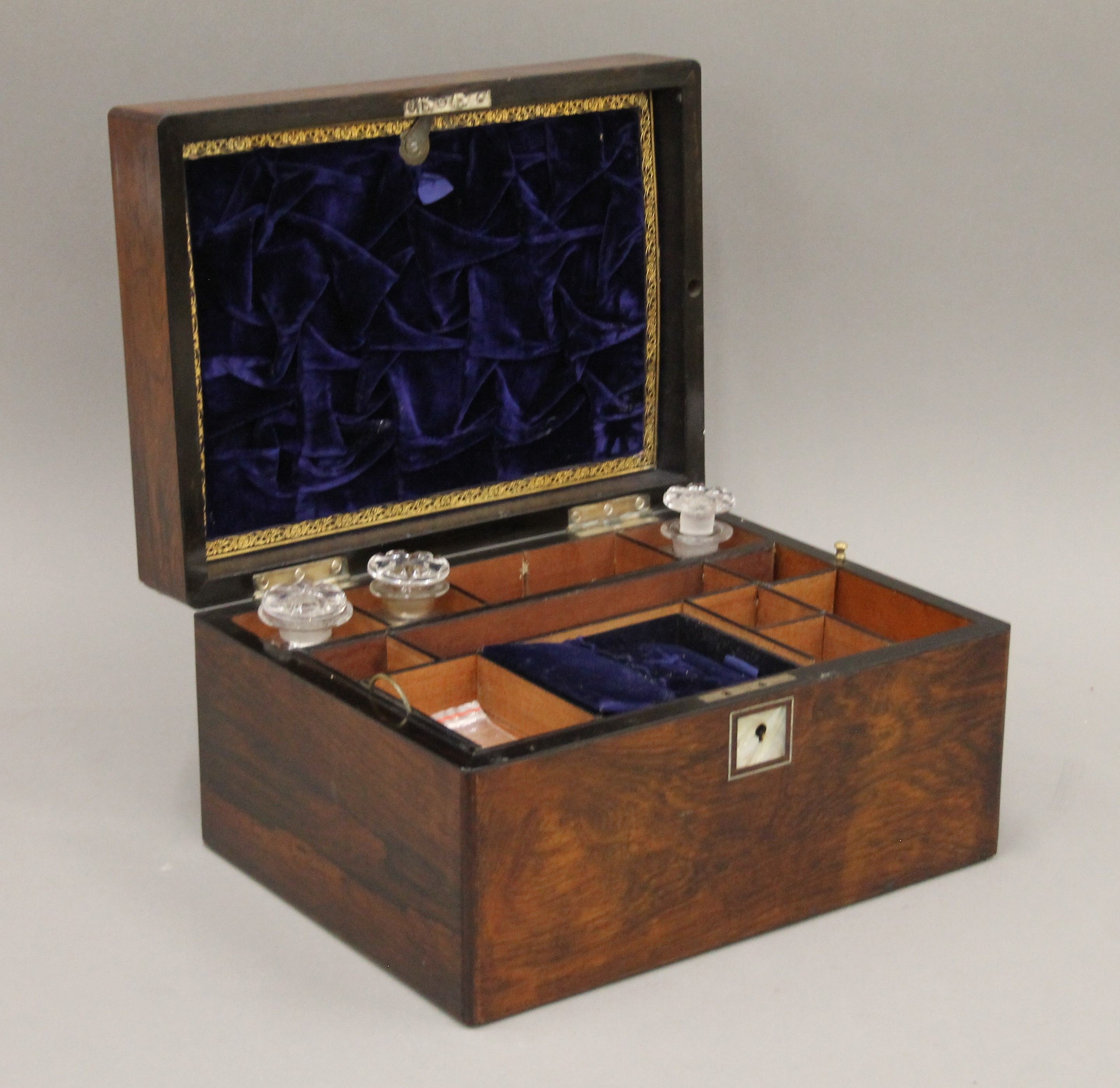 A Victorian mother-of-pearl inlaid rosewood travelling work box. 30 cm wide.
