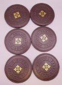 A set of six Patek Philippe coasters. 10 cm diameter.