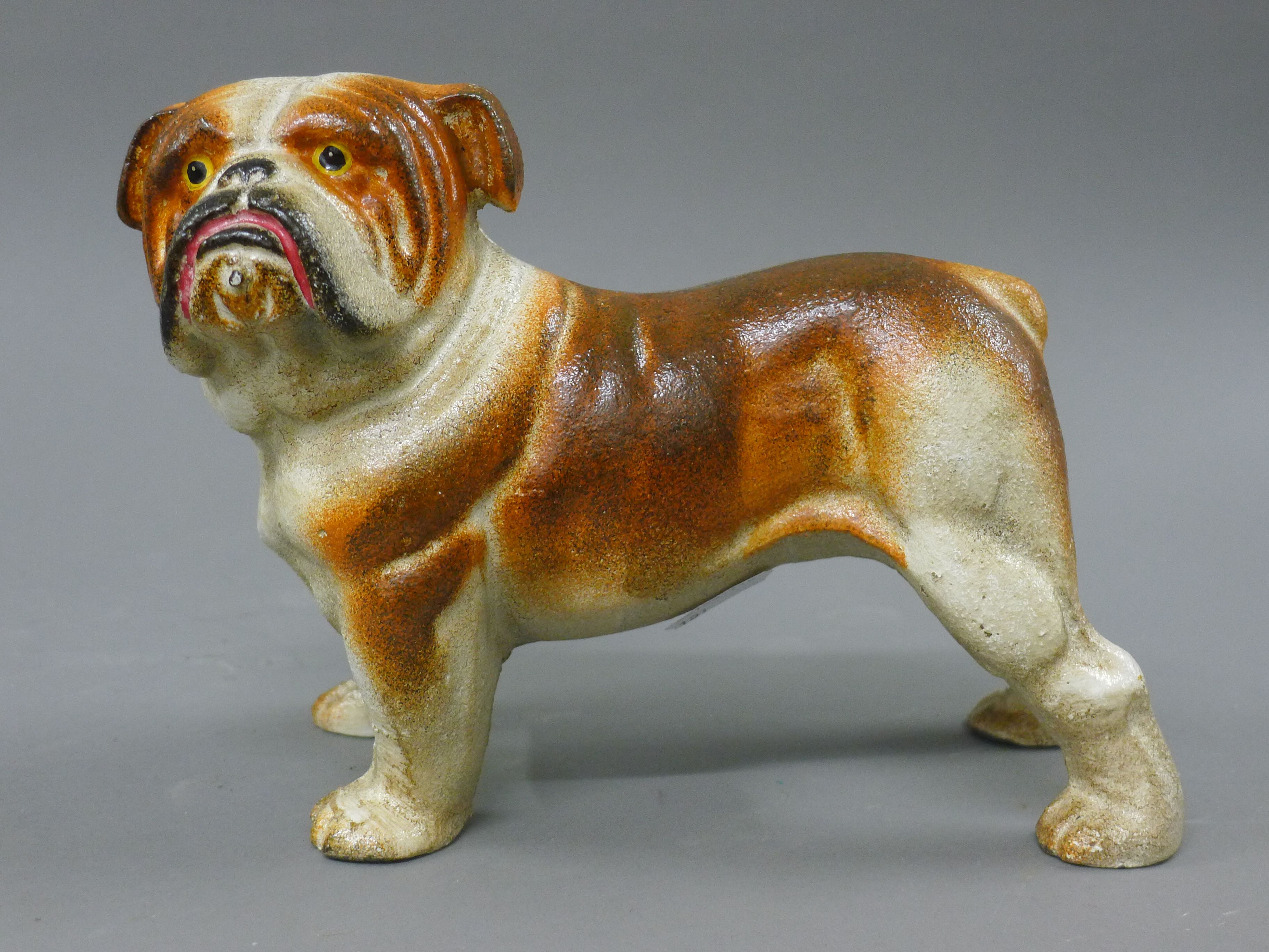 A cast iron model of a bulldog. 23 cm long.