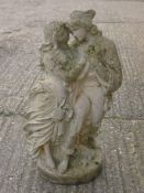 A garden statue formed as a courting couple. 65 cm high.