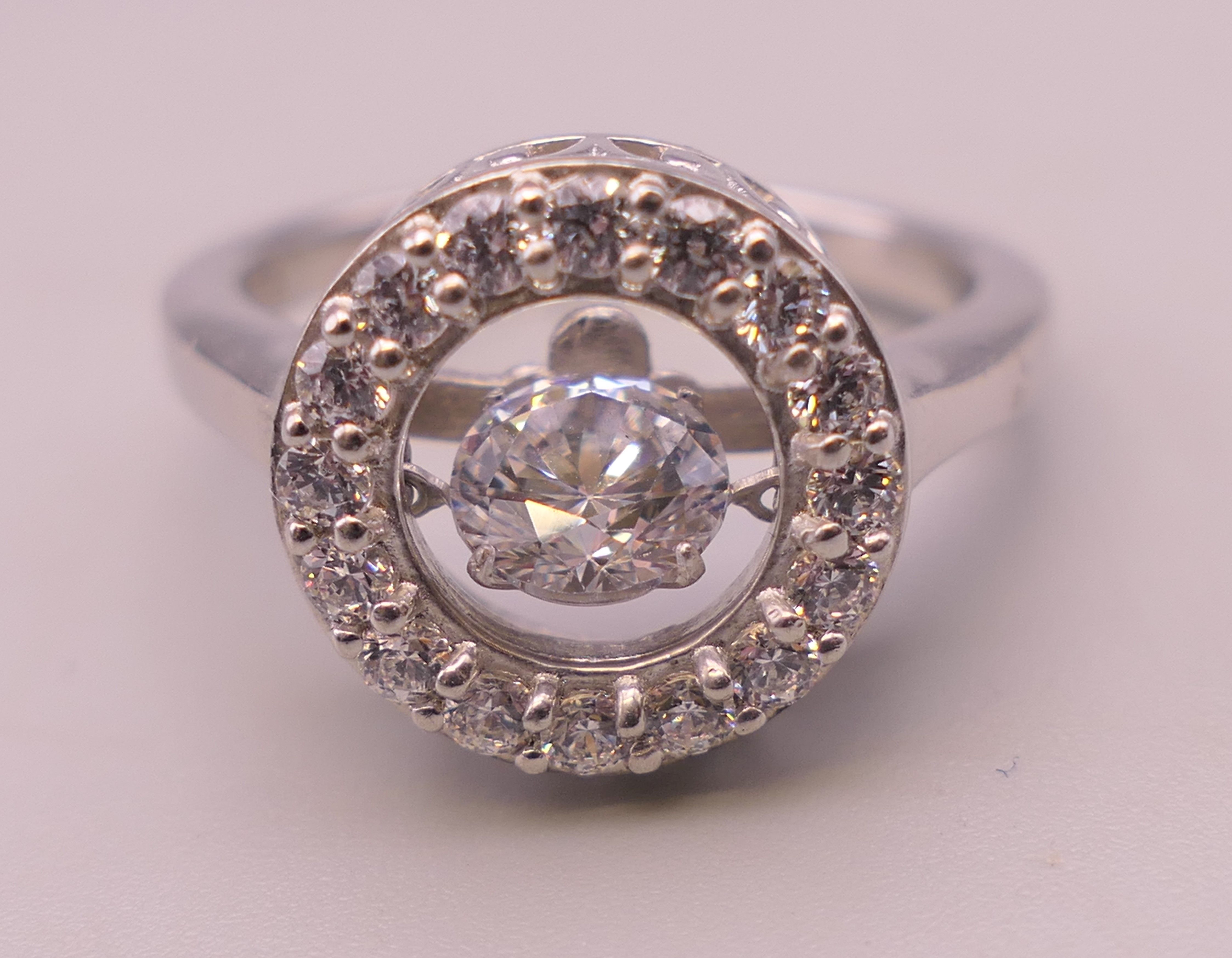 A silver 'swinging' central stone cubic zirconia ring. Ring size Q. - Image 2 of 4