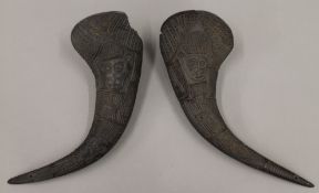 Two tribal carved horns. The largest 34 cm long.