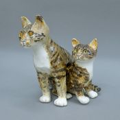 A Winstanley pottery model of two intertwined cats. 23 cm high.