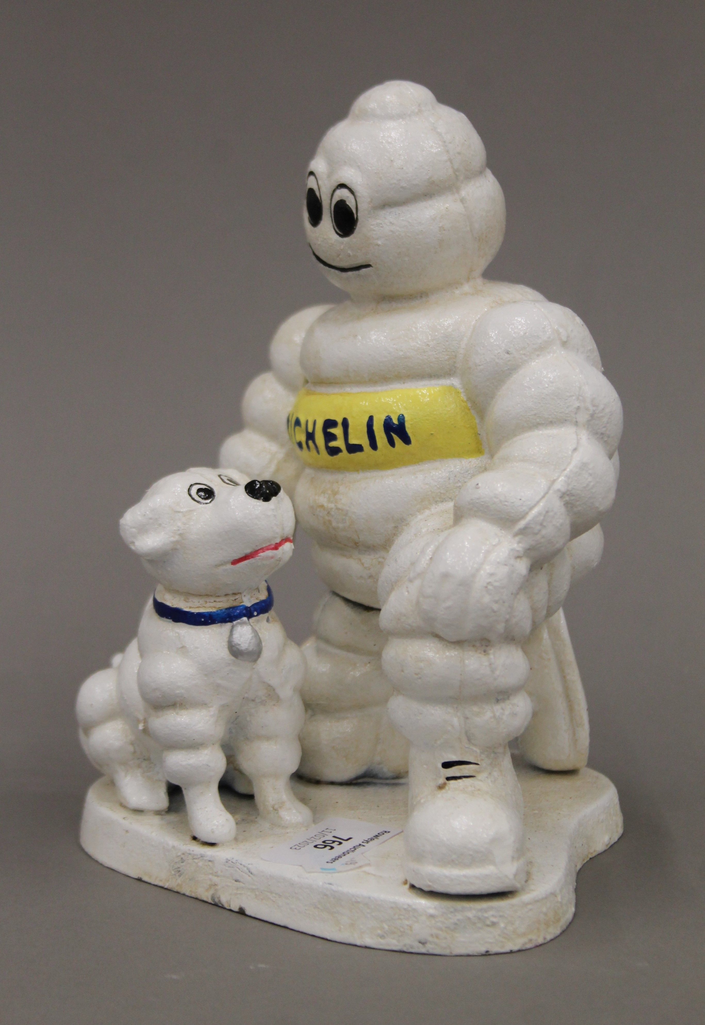 A cast iron Michelin Man and dog. 20 cm high. - Image 2 of 3