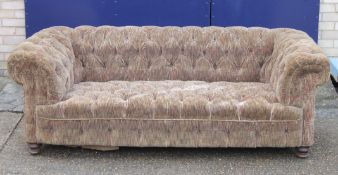 A Victorian Chesterfield settee. Approximately 190 cm long.