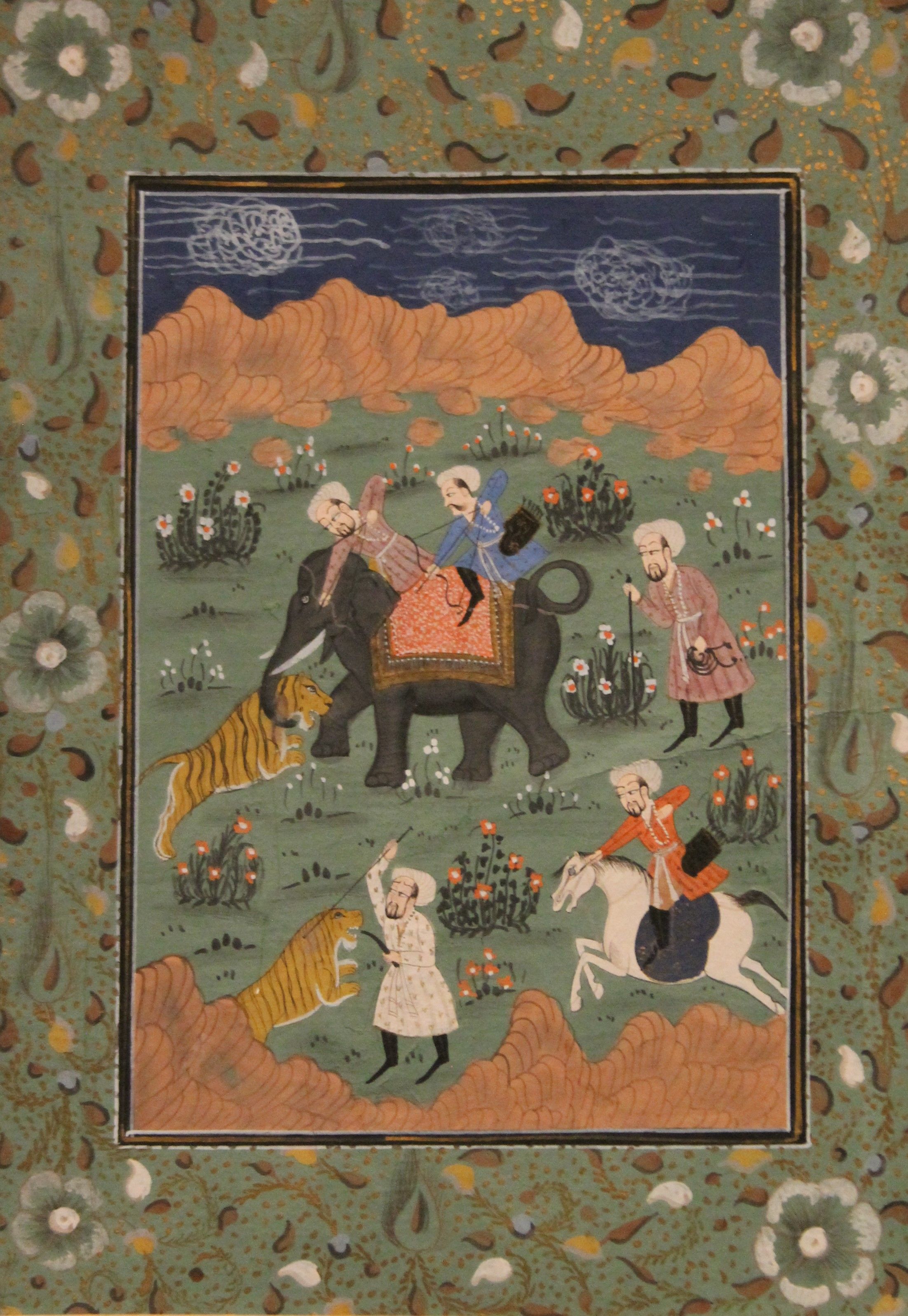 An early Indian watercolour of a tiger hunt with archers, with figures on an elephant,