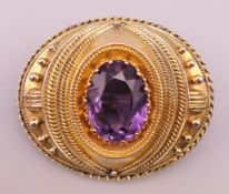 A Victorian unmarked gold, probably 18 ct gold, amethyst mourning brooch, boxed. 4.5 cm x 3.5 cm.