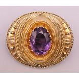 A Victorian unmarked gold, probably 18 ct gold, amethyst mourning brooch, boxed. 4.5 cm x 3.5 cm.