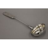 A Latvian silver ladle by Nikolay Shepelev, Riga (1904-1919), with engraved floral decoration.
