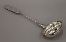 A Latvian silver ladle by Nikolay Shepelev, Riga (1904-1919), with engraved floral decoration.