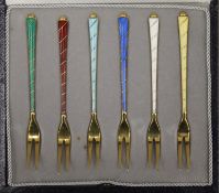 A cased set of six Danish silver gilt and enamel forks. Each 10 cm long.
