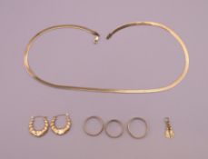 A quantity of 9 ct gold jewellery to include a necklace, three rings,
