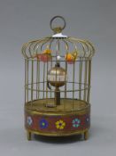 A birdcage clock. 19 cm high.