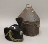 A military hat housed in a tin hat box. The box 30 cm high.