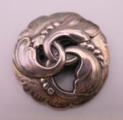 A Georg Jensen silver brooch. 4.5 cm diameter.