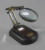 A magnifying lens on stand.