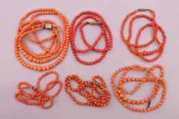 Six coral bead necklaces. Largest approximately 50 cm long.