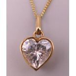 A 9 ct gold heart shaped Valentine pendant on a 9 ct gold chain.
