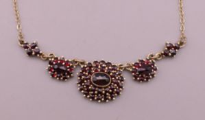 A garnet set necklace. 44 cm long.