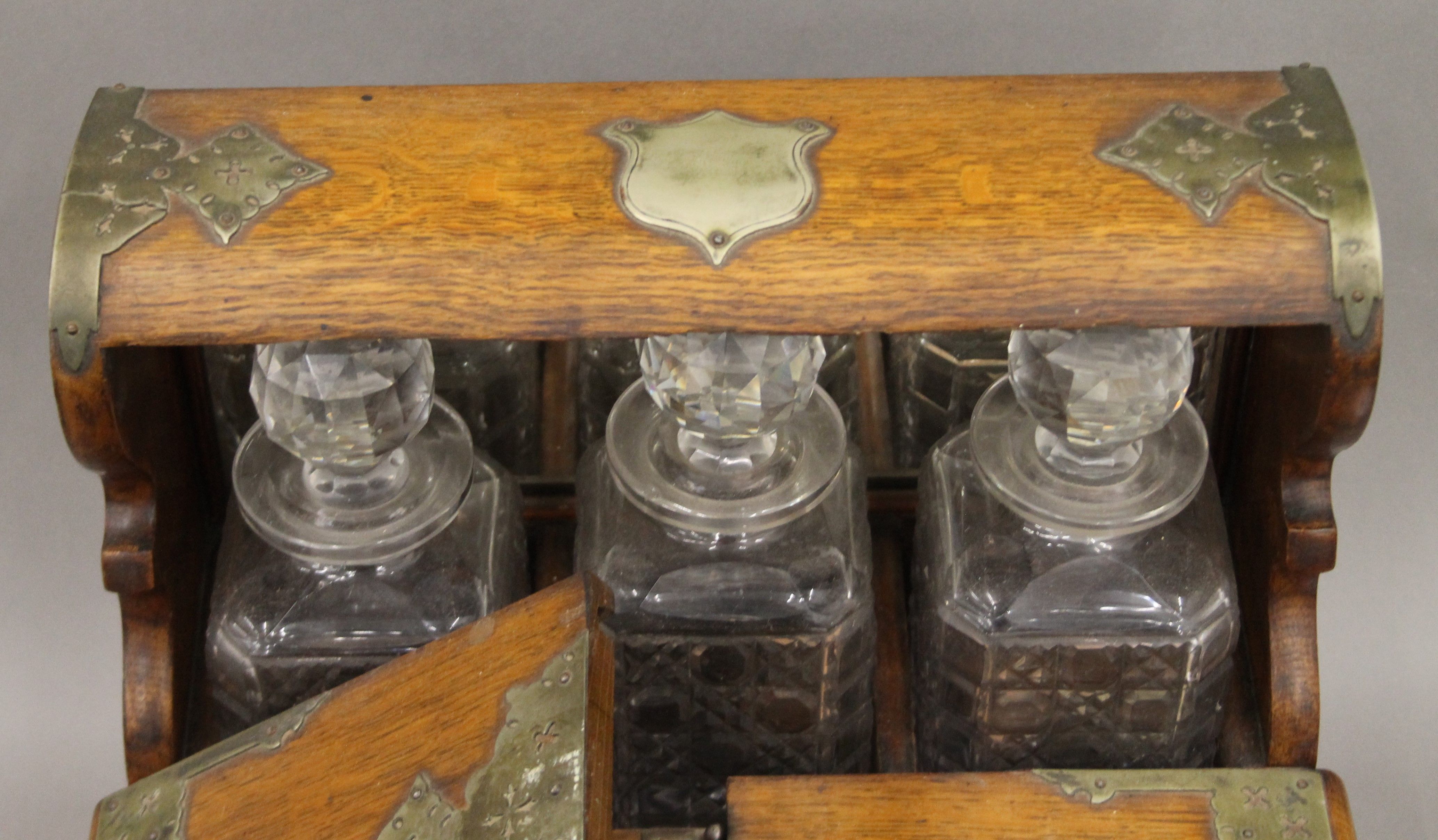 A Victorian silver plate mounted oak games box tantalus. 37 cm wide. - Image 4 of 5