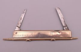 A gold combination double propelling pencil, ruler and penknife by J C Vickery, 181 & 183 Regent St.