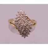 An 18 ct gold diamond cluster ring. Ring size Q/R. 6 grammes total weight.