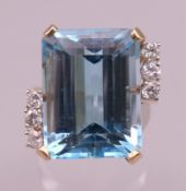 A 14 ct gold diamond and aquamarine ring. Ring size T/U. 12.2 grammes total weight. Aquamarine 1.
