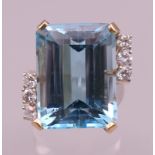 A 14 ct gold diamond and aquamarine ring. Ring size T/U. 12.2 grammes total weight. Aquamarine 1.