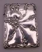 A silver card case. 10 x 7.5 cm.