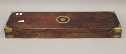A Williams and Powell Victorian brass inset mahogany gun case. 81.5 cm long.