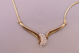 A 14 K gold diamond set necklace. 44 cm long. 11.4 grammes total weight.
