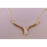 A 14 K gold diamond set necklace. 44 cm long. 11.4 grammes total weight.