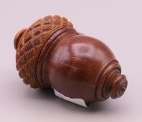 A carved coquilla nut box. 7 cm high.
