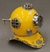 A replica yellow diver's helmet. 43 cm high.