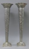 A pair of large silver plated embossed vases. 60 cm high.