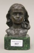 A bronze bust of a girl. 15 cm high.